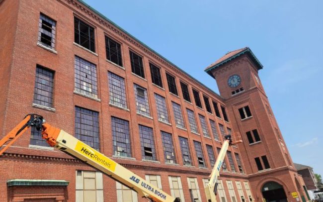 Cranes working on the Brussels Street job by Modern Glazing in Worcester Massachusetts
